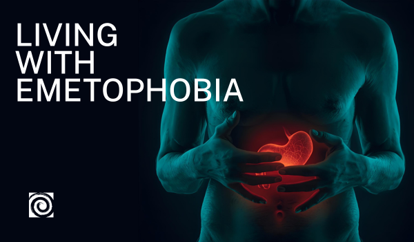 Dark background; male appearing torso lit with blue light, with imagined stomach highlighted in red