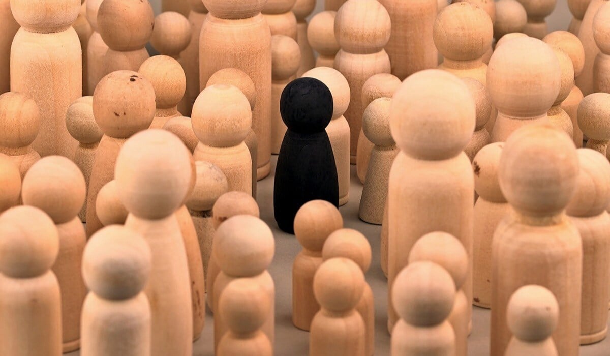 One figure standing out against all the other figures