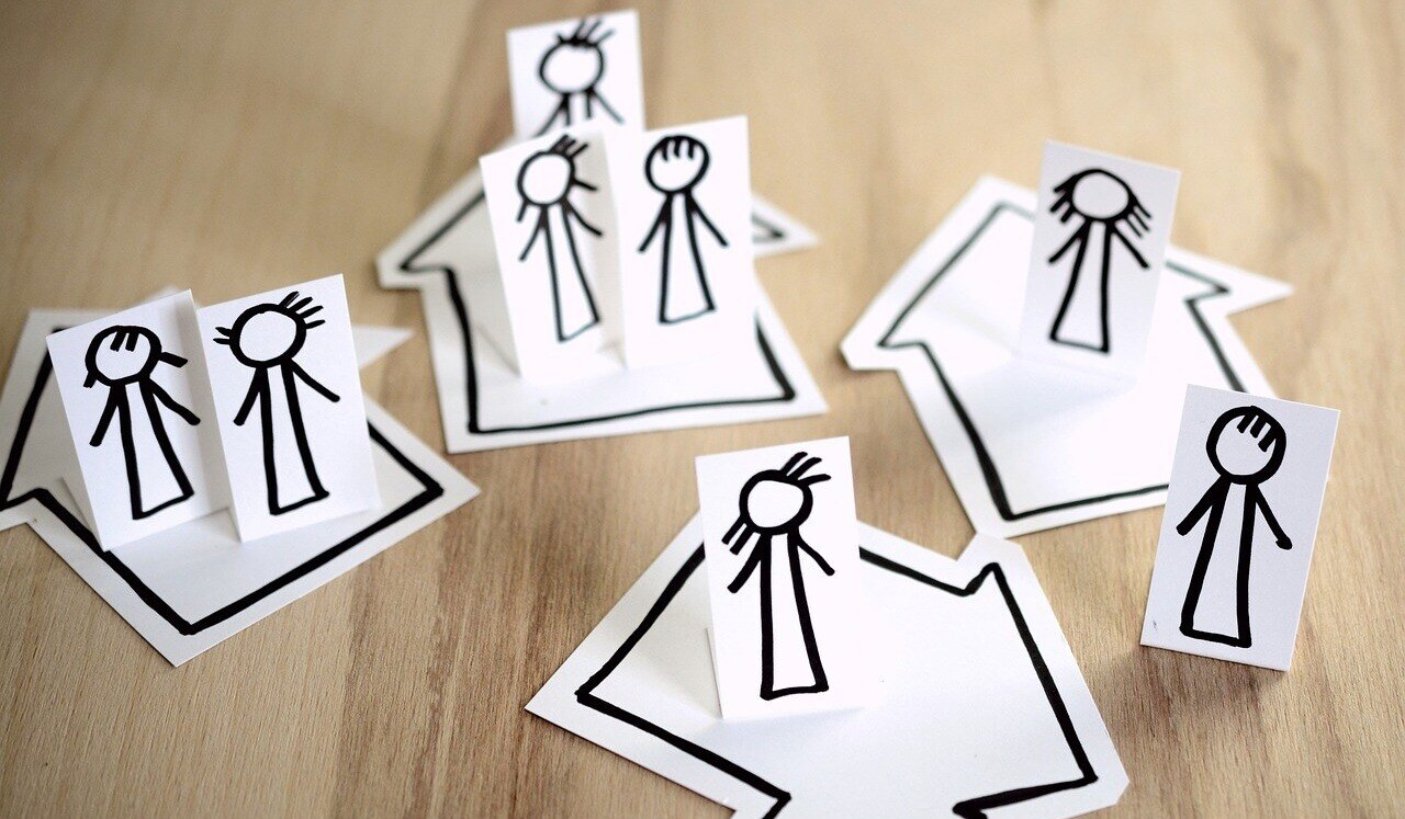 Stick figures in different houses