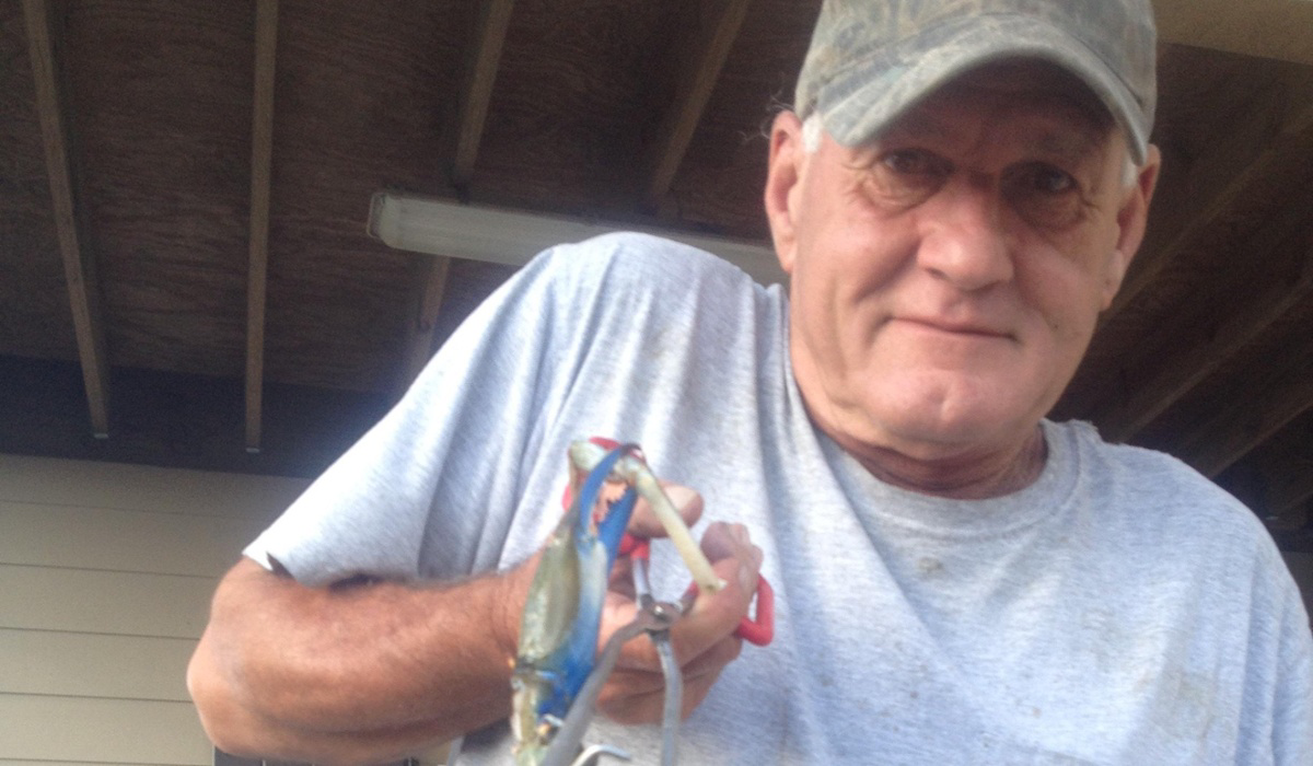 KD' s father holding a massive Louisiana crab