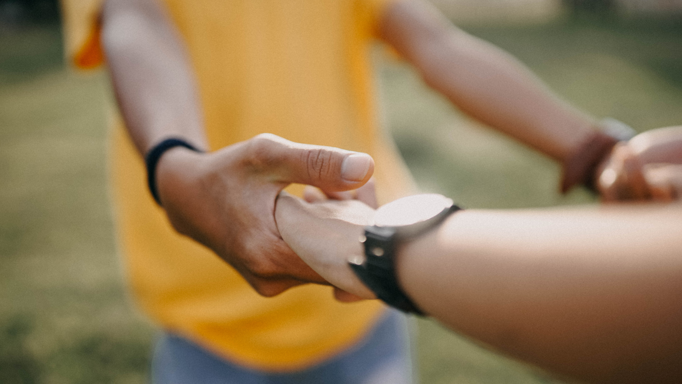 Two people holding hands